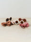 Trend{ING} Baby Sunny Sunglasses Set with hair bows next to them