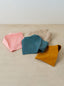 An assortment of Muslin Baby Bibs by Trend{ING}