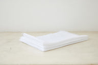 Trend{ING}s Linen Challah/Bread Cover in white; folded on top of each other