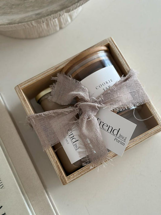 Trend-ings Cookie and milk Gift Box featuring a small storage box, a jar of American chocolate chip biscuits, iced chocolate milk, and a charming linen wrap. 