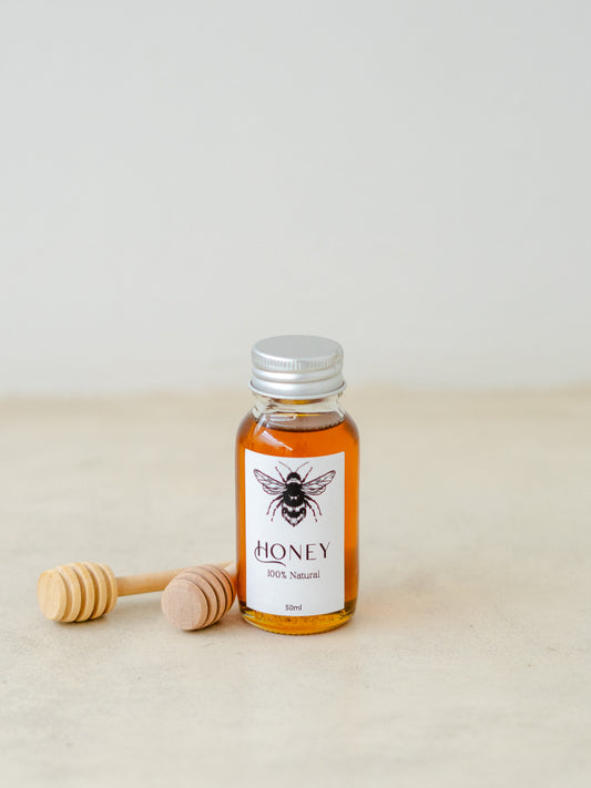 Trend{ING}'s Mini Bee Bottled Honey in 50ml with wooden dipper