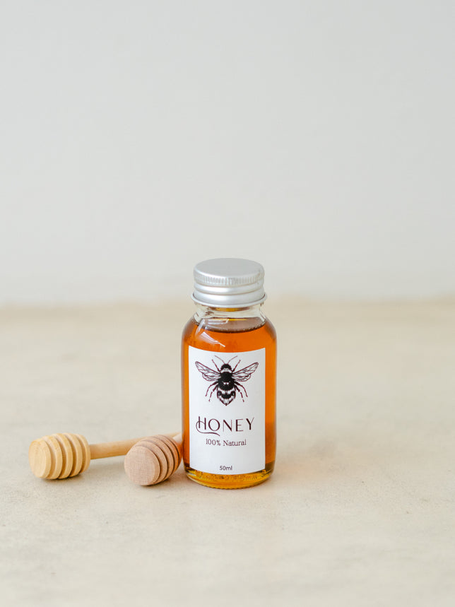 Trend{ING}'s Mini Bee Bottled Honey in 50ml with wooden dipper