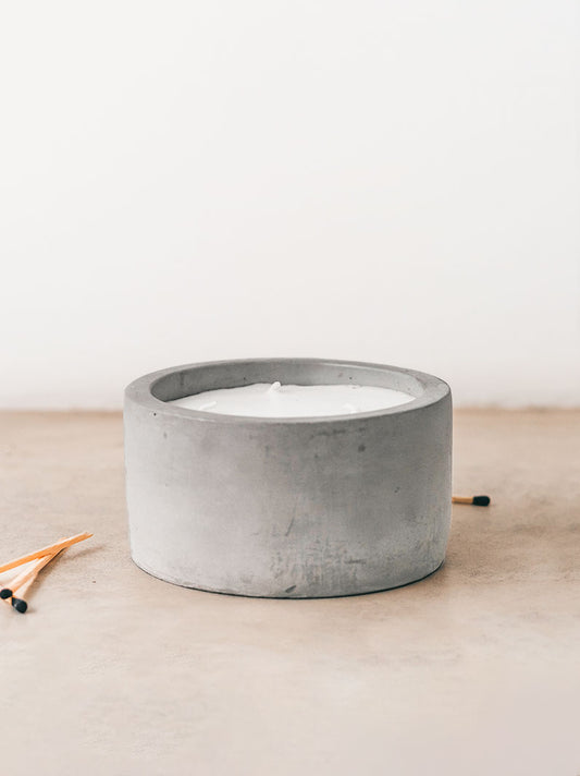 Trend{ING}s Raw Cement Candle with a few long luxury matches beside it