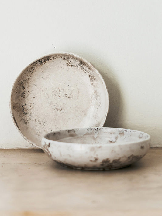 Trend-ings Cafe stone bowl, one up against the wall, and another on the table. Basalt colour