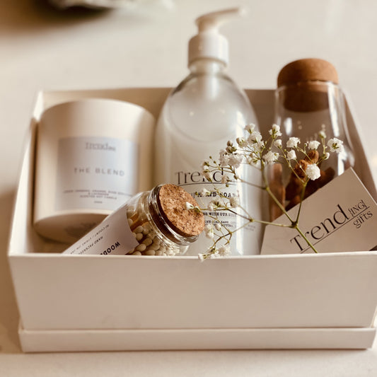 Trend{ING}s Summer Pamper Me Gift Box, featuring Trending signature hand wash, a white ceramic candle, long luxury matches and Nordic jar filled with mini gingerbread men