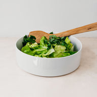 Trend{ING}s White Denmark Salad Bowl - with a green salad and wooden serving spoons