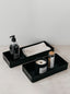 Trend{ING}s deep steel storage tray, small and large size together in black, filled with bathroom items, like our charcoal handwash, towel, wooden wick candle and long luxury matches