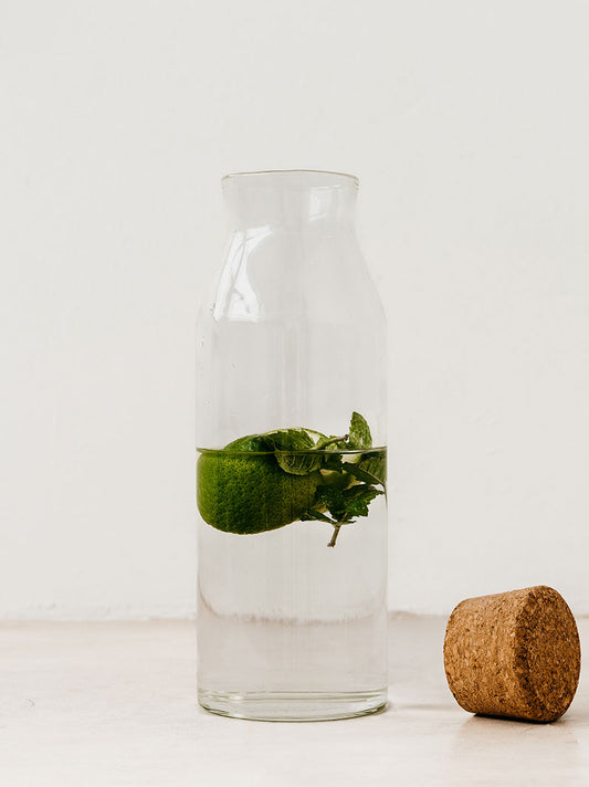 Trend-ings Glass water pitcher with cork stopper; containing water and a lemon