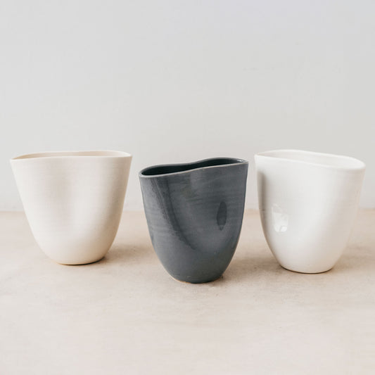 Trend{ING}s Ritual Ceramic Cup, standing in a row of three colours, oatmal, charcoal and white