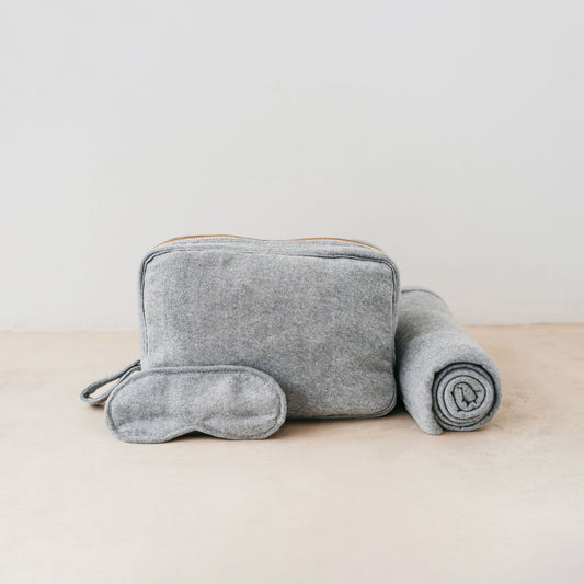 Trend-ings Cotton Travel Bag Kit in grey, with a small blanket and eye mask next to it