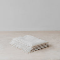 Trend{ING}s Linen Challah/Bread Cover in white; folded on top of each other with frills showing