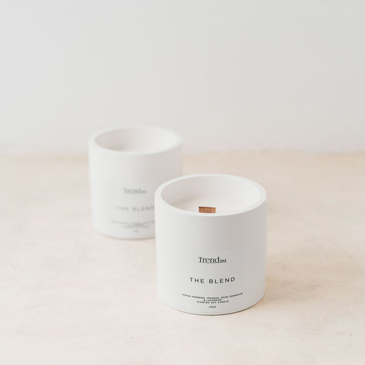 Trend{ING}s white wooden wick candle; 2 candles next to each other with the Trend{ING} branding
