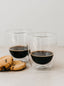 Trend-ings two Zarf Coffee Mugs with some espresso and two choc chip cookies