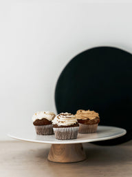 Trend-ings stone cake stand with wooden base and 3 cupcakes on it