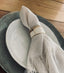 Trend{ING}s Ceramic Napkin Ring on a linen napkin