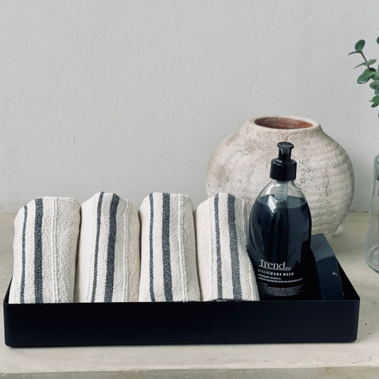 Trend{ING}s deep steel storage tray,  with bathroom hand towels and charcoal handwash